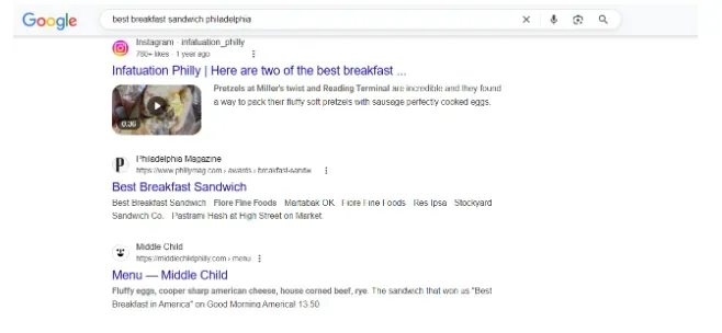 IGoogle search results page for "best breakfast sandwich philadelphia" showing links to Infatuation Philly, Philadelphia Magazine, and Middle Child menu.